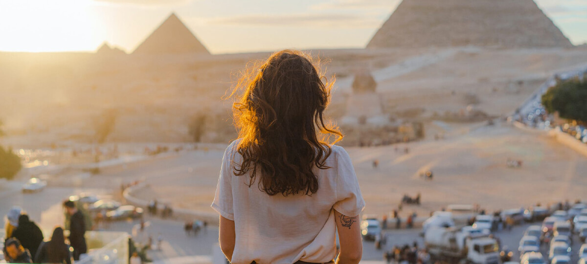 Egypt Nile Cruise Tips To Choose & Book Best Nile Cruise 3 A wonderful cat girl in front of the pyramids cairo