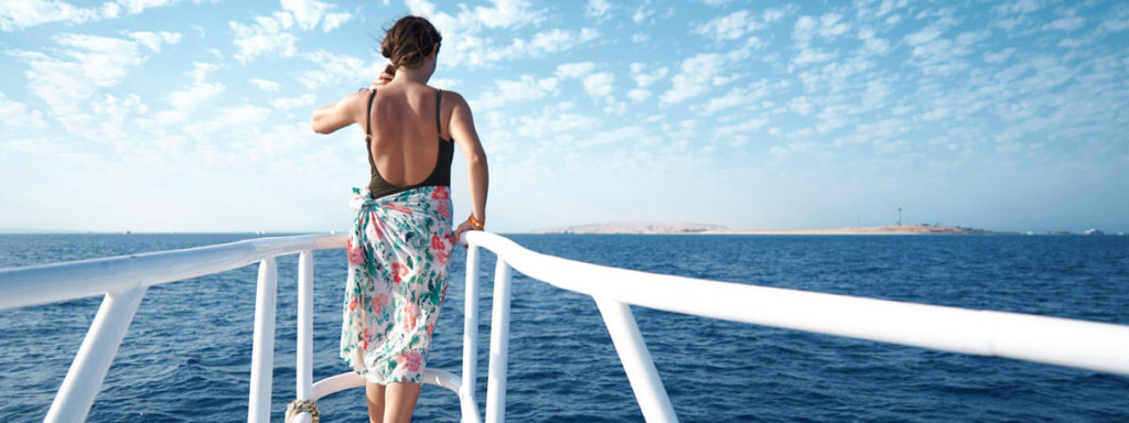 A beautiful photo of a tourist on a cruise enjoying her solo trip in Egypt