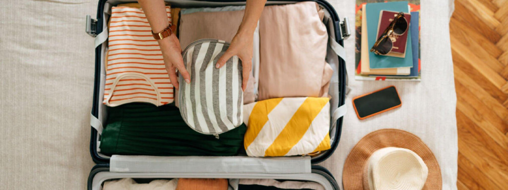 A picture of a tourist preparing his travel bag